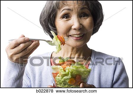 senior woman eating salad View Large Photo Image Stock Photo - senior woman eating salad. Fotosearch