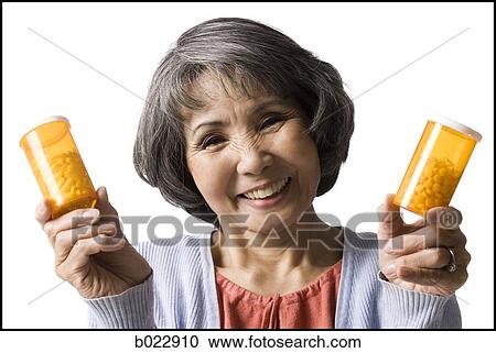 senior woman holding bottles of pills View Large Photo Image Stock Image - senior woman holding bottles of pills. Fotosearch
