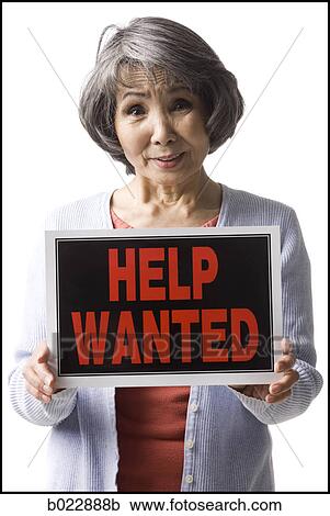 senior woman holding help wanted sign View Large Photo Image Stock Image - senior woman holding help wanted sign. Fotosearch