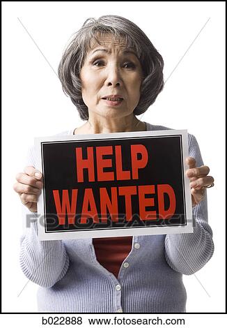 senior woman holding help wanted sign View Large Photo Image Stock Photo - senior woman holding help wanted sign. Fotosearch