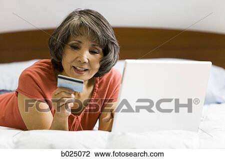 senior woman shopping online View Large Photo Image Stock Image - senior woman shopping online. Fotosearch
