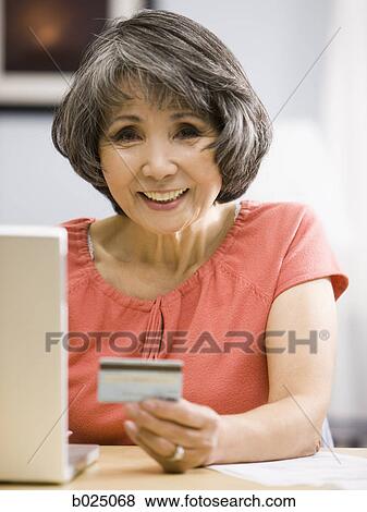 senior woman shopping online View Large Photo Image Stock Photo - senior woman shopping online. Fotosearch