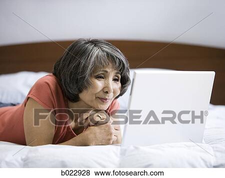 senior woman using a laptop computer View Large Photo Image Stock Photo - senior woman using a laptop computer. Fotosearch