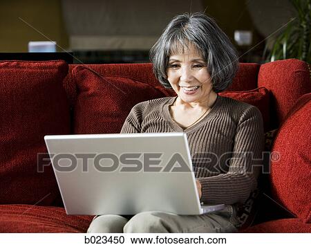 senior woman using a laptop View Large Photo Image Stock Image - senior woman using a laptop. Fotosearch