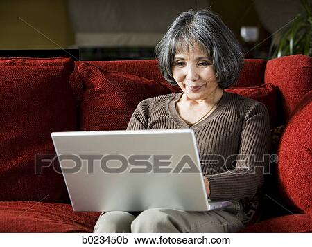 senior woman using a laptop View Large Photo Image Stock Image - senior woman using a laptop. Fotosearch