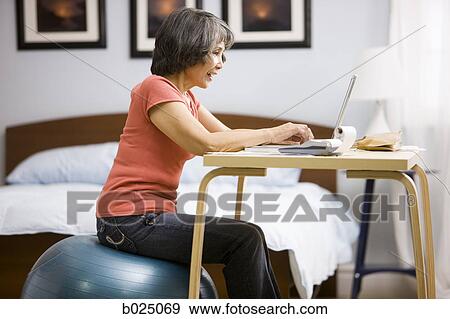 senior woman using a laptop View Large Photo Image Stock Photo - senior woman using a laptop. Fotosearch