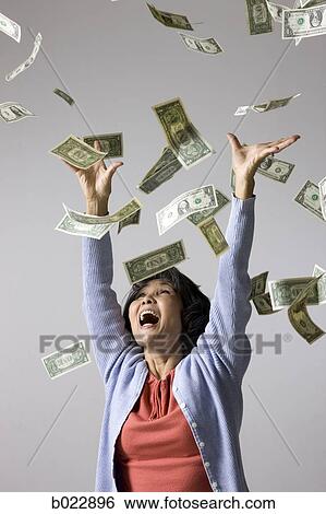 senior woman with money falling around her View Large Photo Image Stock Photograph - senior woman with money falling around her. Fotosearch