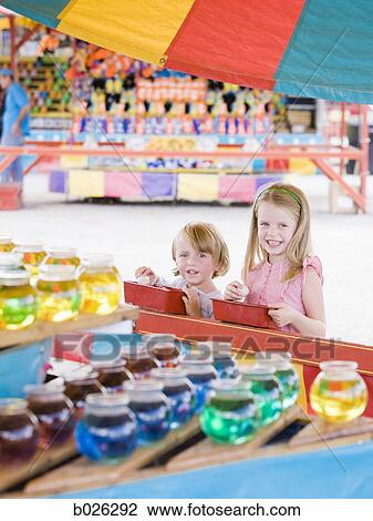 siblings at a carnival View Large Photo Image Stock Image - siblings at a carnival. Fotosearch