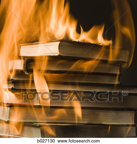 Stock Image - stack of books on fire. Fotosearch