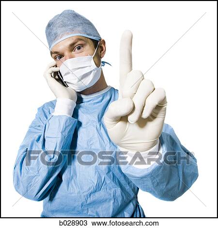 surgeon on a cell phone View Large Photo Image Stock Image - surgeon on a cell phone. Fotosearch