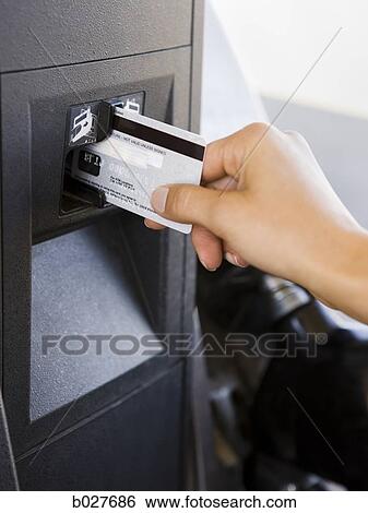 swiping credit card through a gas pump payment terminal View Large Photo Image Stock Photograph - swiping credit card through a gas pump payment terminal. Fotosearch