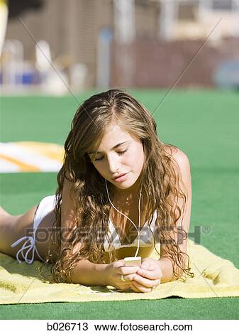 teenage girl in a white swimsuit View Large Photo Image Stock Image - teenage girl in a white swimsuit. Fotosearch