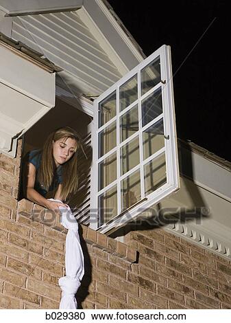teenager climbing out of her bedroom window View Large Photo Image Stock Image - teenager climbing out of her bedroom window. Fotosearch