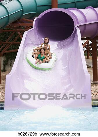 Stock Image - teenagers at a waterpark. Fotosearch