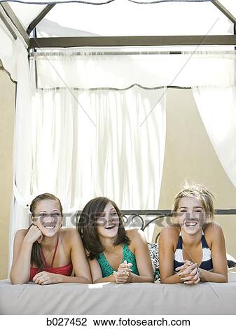 teenagers in a poolside cabana View Large Photo Image Stock Image - teenagers in a poolside cabana. Fotosearch