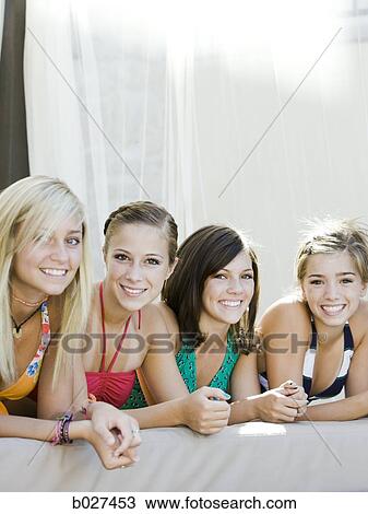 teenagers in a poolside cabana View Large Photo Image Stock Image - teenagers in a poolside cabana. Fotosearch