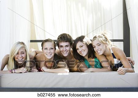 teenagers in a poolside cabana View Large Photo Image Stock Photography - teenagers in a poolside cabana. Fotosearch