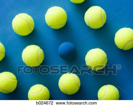 tennis balls and a racquetball against a blue background View Large Photo Image Stock Image - tennis balls and a racquetball against a blue background. Fotosearch