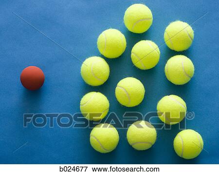 tennis balls and a racquetball against a blue background View Large Photo Image Stock Photo - tennis balls and a racquetball against a blue background. Fotosearch