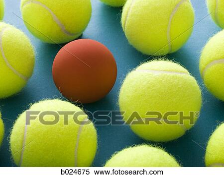 tennis balls and a racquetball against a blue background View Large Photo Image Stock Photography - tennis balls and a racquetball against a blue background. Fotosearch