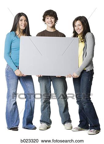 three teenagers holding a sign View Large Photo Image Stock Image - three teenagers holding a sign. Fotosearch