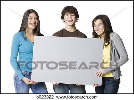 three teenagers holding a sign View Large Photo Image Stock Image - three teenagers holding a sign. Fotosearch