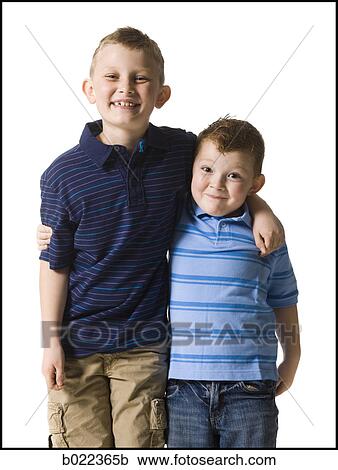 two boys looking at the camera View Large Photo Image Stock Image - two boys looking at the camera. Fotosearch