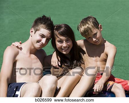 Stock Photo - two brothers and their sister. Fotosearch
