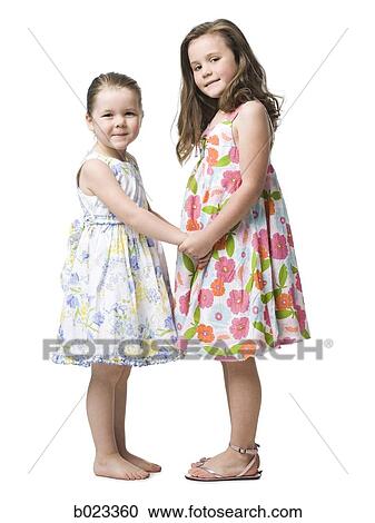 Stock Image - two girls in dresses. Fotosearch