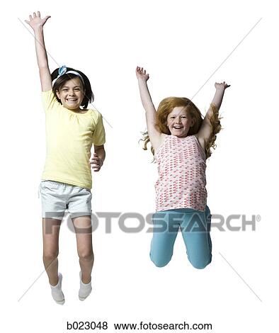 two girls jumping View Large Photo Image Stock Photo - two girls jumping. Fotosearch