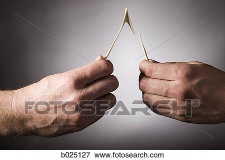 two hands breaking a wishbone View Large Photo Image Stock Photo - two hands breaking a wishbone. Fotosearch