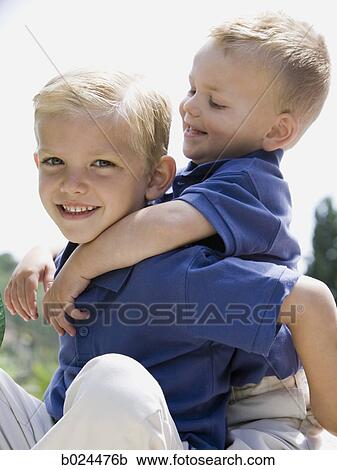 two little boys in blue shirts View Large Photo Image Stock Image - two little boys in blue shirts. Fotosearch