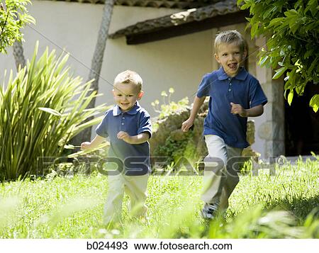 two little boys in blue shirts View Large Photo Image Stock Image - two little boys in blue shirts. Fotosearch