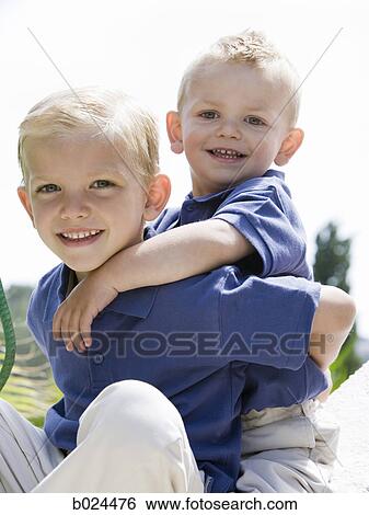 two little boys in blue shirts View Large Photo Image Stock Photograph - two little boys in blue shirts. Fotosearch