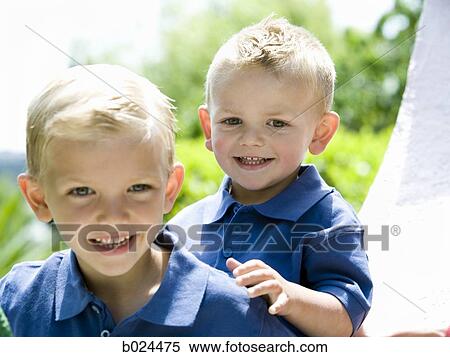 two little boys in blue shirts View Large Photo Image Stock Photography - two little boys in blue shirts. Fotosearch