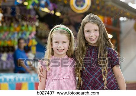 two sisters at the carnival View Large Photo Image Stock Photo - two sisters at the carnival. Fotosearch