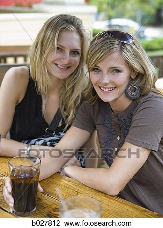 two women having a drink View Large Photo Image Stock Image - two women having a drink. Fotosearch