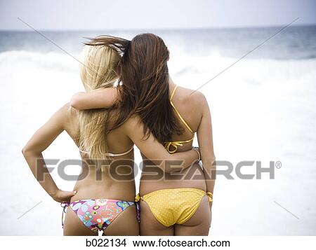 two young women at the beach View Large Photo Image Picture - two young women at the beach. Fotosearch