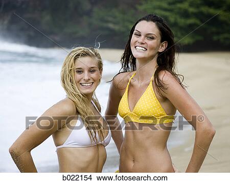 two young women at the beach View Large Photo Image Picture - two young women at the beach. Fotosearch