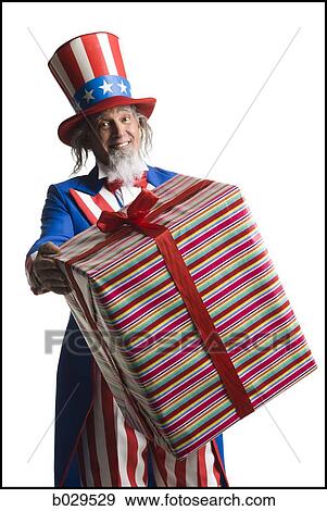 uncle sam holding a gift View Large Photo Image Stock Photo - uncle sam holding a gift. Fotosearch