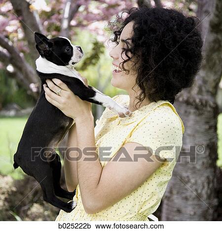Stock Image - woman and her dog. Fotosearch