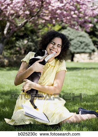 Stock Image - woman and her dog. Fotosearch