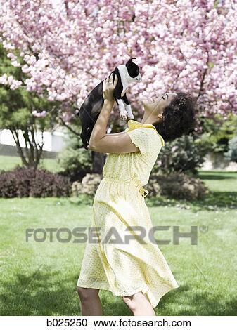 Stock Image - woman and her dog. Fotosearch