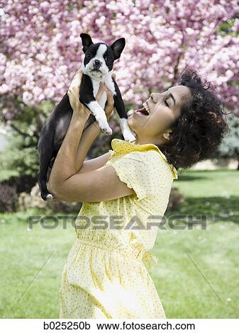 Stock Image - woman and her dog. Fotosearch