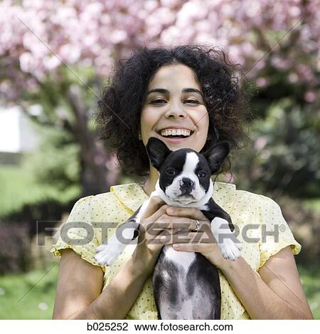 Stock Image - woman and her dog. Fotosearch