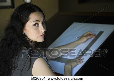 Stock Image - woman at a drafting table. Fotosearch