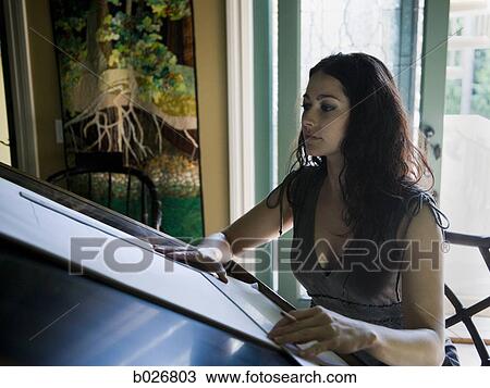 Stock Image - woman at a drafting table. Fotosearch