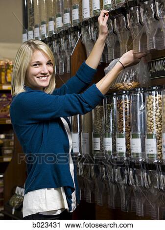 woman buying nuts at the supermarket View Large Photo Image Stock Image - woman buying nuts at the supermarket. Fotosearch