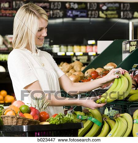 woman buying produce at the supermarket View Large Photo Image Stock Photo - woman buying produce at the supermarket. Fotosearch
