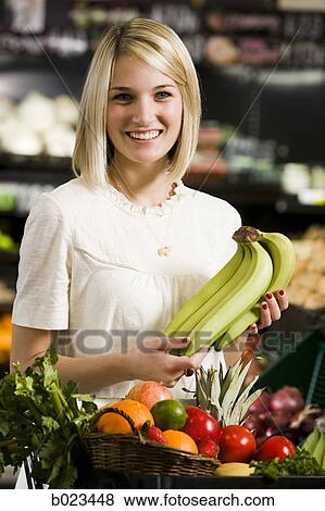 woman buying produce at the supermarket View Large Photo Image Stock Photo - woman buying produce at the supermarket. Fotosearch